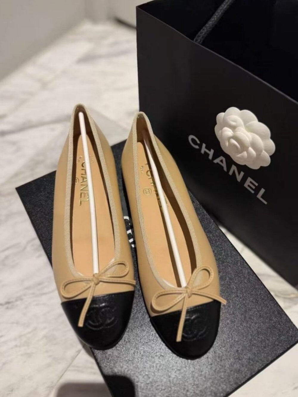 CHANEL Beige & Black  Embossed CC Slip-On Ballet Flats